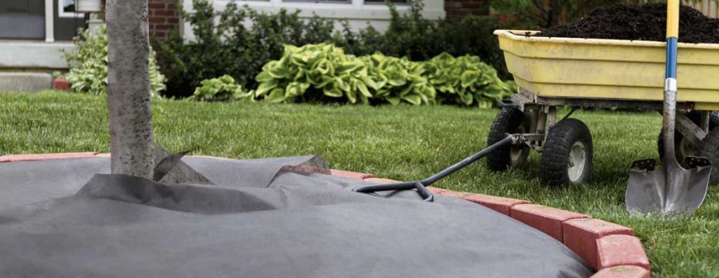 One of the best ways to deter weed growth in your flowerbed, patio, or walkway is to use a weed barrier fabric.